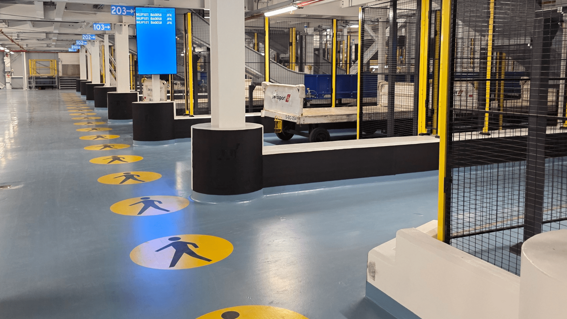 Floor signage in a baggage hall