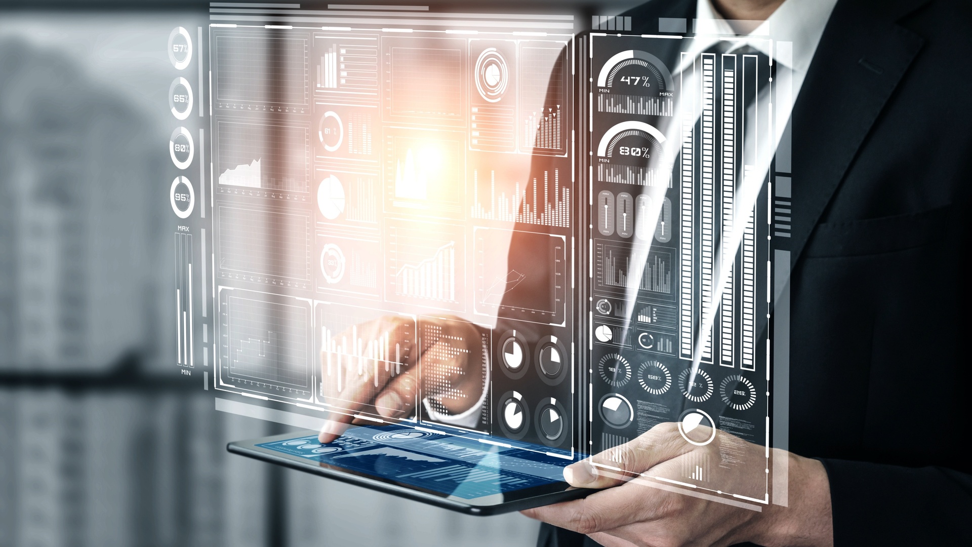 A business man reviews a digital dashboard