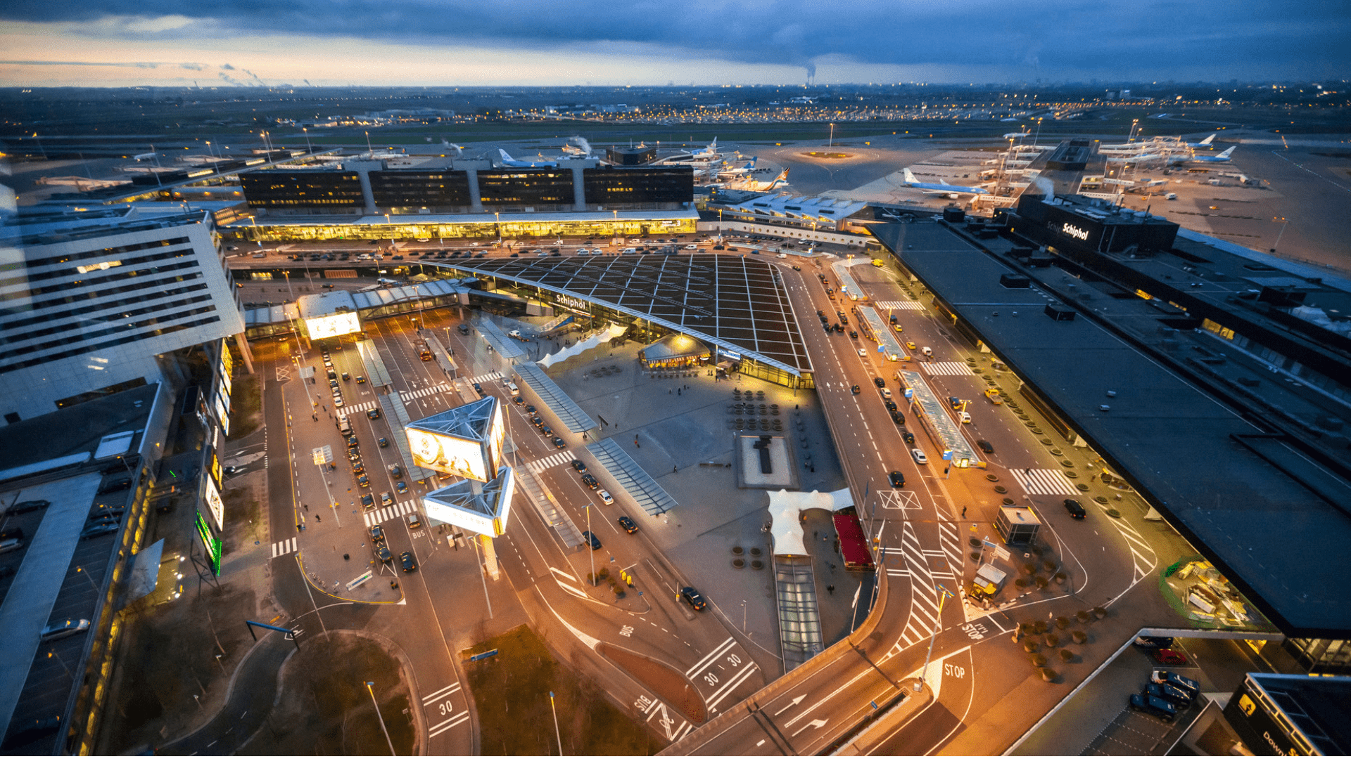 Schiphol airport from above showing the terminal and airplanes