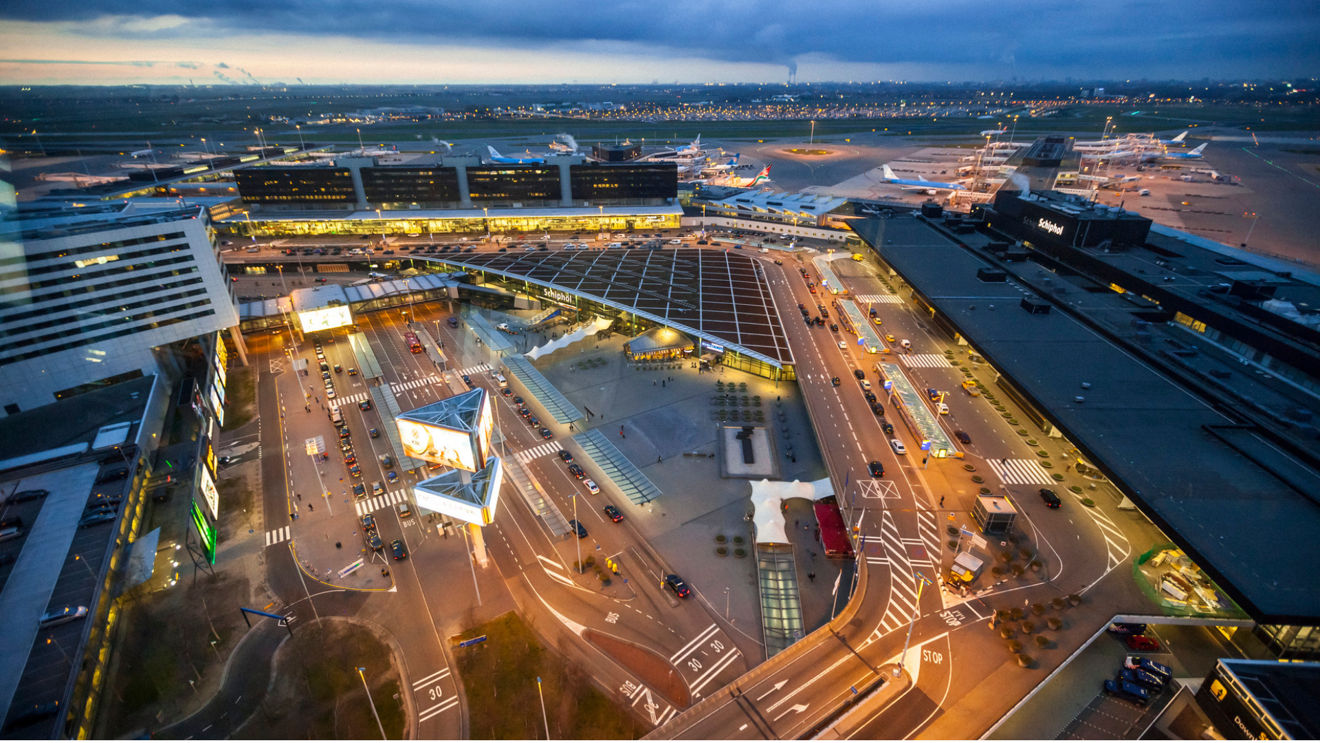 Schiphol airport from above showing the terminal and airplanes