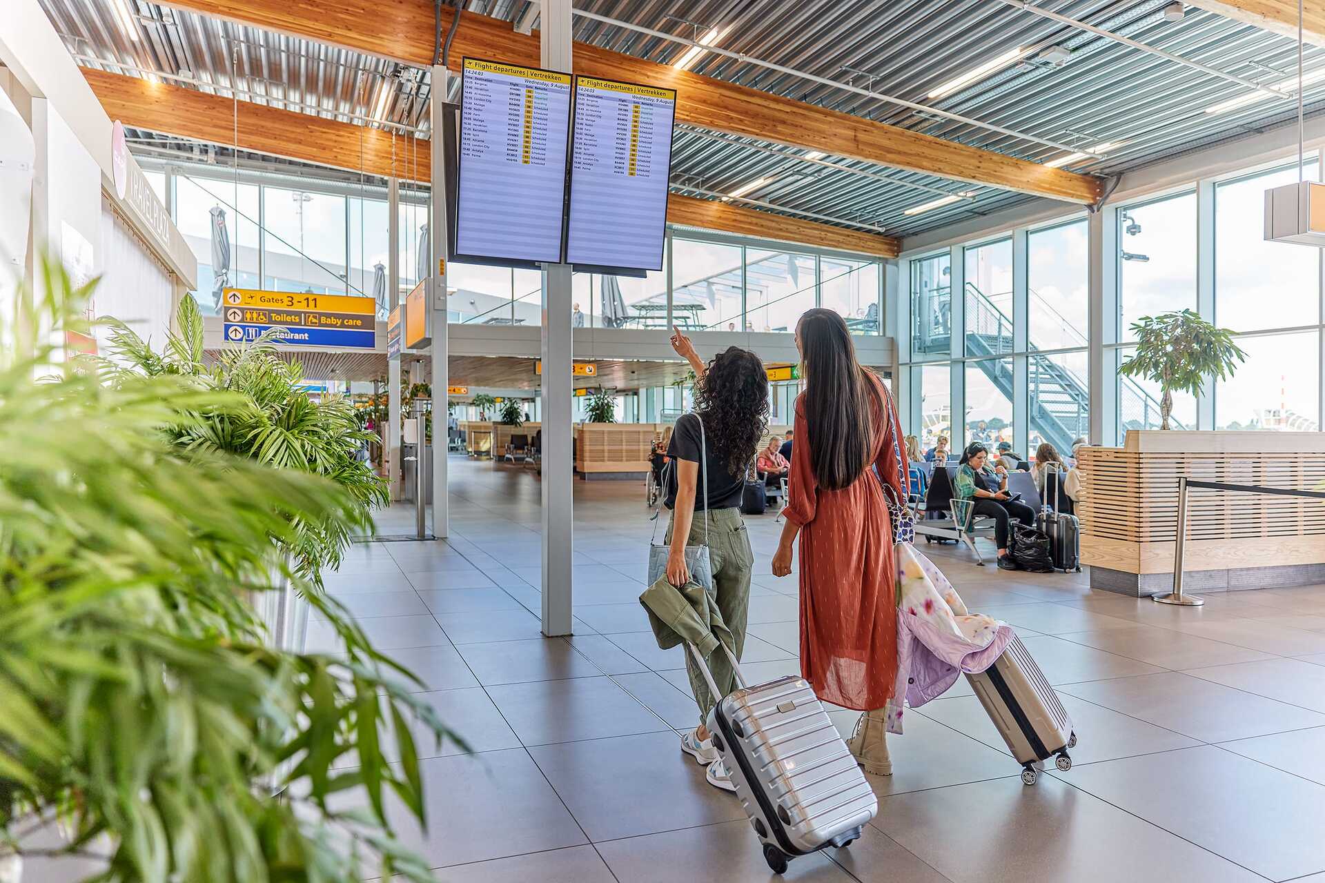 Passengers in a terminal at Rotterdam The Hague Airport